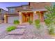 Charming two-story home with well maintained desert landscaping, brick steps and portico at 928 Riverlawn Pl, Las Vegas, NV 89138