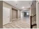 Entry foyer with view of the living room and stairs with wooden floors and natural lighting at 928 Riverlawn Pl, Las Vegas, NV 89138