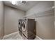 Laundry room featuring stainless steel washer and dryer set at 928 Riverlawn Pl, Las Vegas, NV 89138