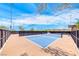 Community pickle ball court surrounded by black fencing with neighborhood views at 928 Riverlawn Pl, Las Vegas, NV 89138