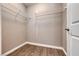 Walk-in closet with wire shelving and wood-look flooring at 928 Riverlawn Pl, Las Vegas, NV 89138