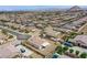 Aerial view of home with low maintenance backyard, covered patio, and detached shed at 10470 Irish Cliffs Ct, Las Vegas, NV 89149