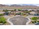 Aerial view of a cul-de-sac home with a low maintenance yard and mountain views at 10470 Irish Cliffs Ct, Las Vegas, NV 89149