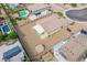Aerial view of the backyard featuring the covered patio, low maintenance yard, and detached shed at 10470 Irish Cliffs Ct, Las Vegas, NV 89149