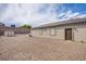 Wide backyard with gravel, block wall, storage shed, and covered patio provides tons of outdoor space at 10470 Irish Cliffs Ct, Las Vegas, NV 89149