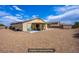 Spacious backyard features block wall, storage shed, covered patio, and low-maintenance gravel at 10470 Irish Cliffs Ct, Las Vegas, NV 89149