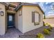 Inviting entryway with a decorative glass front door and stone accents enhancing curb appeal at 10470 Irish Cliffs Ct, Las Vegas, NV 89149