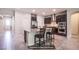 Modern kitchen with stainless steel appliances, dark cabinetry, and a granite-topped island at 10470 Irish Cliffs Ct, Las Vegas, NV 89149