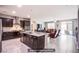 The kitchen features an island and seamlessly blends into the living area, perfect for modern living at 10470 Irish Cliffs Ct, Las Vegas, NV 89149