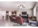 An open-concept layout seamlessly connects the kitchen and living room, promoting a sense of togetherness at 10470 Irish Cliffs Ct, Las Vegas, NV 89149