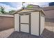 Durable storage shed provides room for landscaping equipment, tools, and backyard storage at 10470 Irish Cliffs Ct, Las Vegas, NV 89149