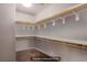 Spacious walk-in closet featuring wood shelves and ample storage space for clothes and accessories at 10470 Irish Cliffs Ct, Las Vegas, NV 89149