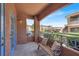Cozy outdoor balcony with comfortable seating and a relaxing view at 10553 Pine Glen Ave # 101, Las Vegas, NV 89144