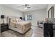 Cozy bedroom featuring a plush bed, carpet, and windows with natural light at 10553 Pine Glen Ave # 101, Las Vegas, NV 89144