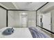Spacious bedroom with modern décor, leading to the en-suite bathroom at 10553 Pine Glen Ave # 101, Las Vegas, NV 89144