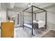 Bedroom with a canopy bed, a rug and a door at 10553 Pine Glen Ave # 101, Las Vegas, NV 89144