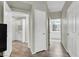 Hallway with doors to the laundry room and bathroom showcasing the home's layout at 10553 Pine Glen Ave # 101, Las Vegas, NV 89144