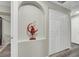 Hallway with an archway, neutral paint and a closet at 10553 Pine Glen Ave # 101, Las Vegas, NV 89144