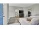 Open-concept living room featuring modern decor, hard flooring and a large couch at 10553 Pine Glen Ave # 101, Las Vegas, NV 89144