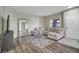 Comfortable living room with neutral tones, stylish furnishings, and natural light at 10553 Pine Glen Ave # 101, Las Vegas, NV 89144