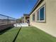 Landscaped backyard with a spa, artificial turf, and views of the surrounding mountains at 146 Cabo Cruces Dr, Henderson, NV 89011