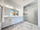 Bathroom showcasing a double sink vanity with white countertops and a large glass shower at 146 Cabo Cruces Dr, Henderson, NV 89011