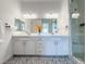 Modern bathroom boasts double vanity and large mirrors at 146 Cabo Cruces Dr, Henderson, NV 89011