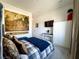 Bedroom with a navy bedspread, unique wall decor and recessed lighting at 146 Cabo Cruces Dr, Henderson, NV 89011