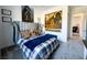 A comfortably decorated bedroom featuring blue bedding, decorative pillows and horse themed wall art at 146 Cabo Cruces Dr, Henderson, NV 89011