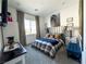 Nicely decorated bedroom with a horse-themed wall art and a plush bed at 146 Cabo Cruces Dr, Henderson, NV 89011