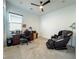 Cozy bedroom with plush carpeting, ceiling fan, an office desk area, and a massage chair at 146 Cabo Cruces Dr, Henderson, NV 89011