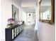 Elegant hallway featuring sophisticated decor, a decorative mirror, and stylish flooring, adding a touch of luxury at 146 Cabo Cruces Dr, Henderson, NV 89011
