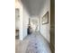 Bright hallway showcasing stylish decor and tile flooring, leading to various rooms in the home at 146 Cabo Cruces Dr, Henderson, NV 89011