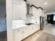 A modern kitchen features stainless steel appliances, white countertops, and ample cabinet space at 146 Cabo Cruces Dr, Henderson, NV 89011