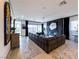 The luxurious living room features a large leather couch and modern fireplace at 146 Cabo Cruces Dr, Henderson, NV 89011