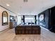 Spacious living room featuring a large sectional, modern decor, and sliding doors to an outdoor space at 146 Cabo Cruces Dr, Henderson, NV 89011