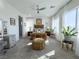A luxurious bedroom featuring neutral tones, plush carpeting, and large windows with natural light at 146 Cabo Cruces Dr, Henderson, NV 89011