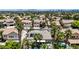 Beautiful aerial view of a home and pool surrounded by palm trees in a quiet residential neighborhood at 1509 Winslow St, Las Vegas, NV 89117