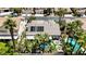 Aerial view of property showcasing pool, lush landscaping, and surrounding neighborhood at 1509 Winslow St, Las Vegas, NV 89117