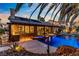 Resort-style backyard showcasing a pool, hot tub, covered patio, and outdoor kitchen, creating an ideal space for relaxation and entertainment at 1509 Winslow St, Las Vegas, NV 89117