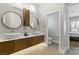 Bathroom featuring double vessel sinks, stone countertops, modern cabinets, and access to the main bedroom at 1509 Winslow St, Las Vegas, NV 89117