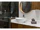 Beautiful bathroom featuring a stone countertop, modern cabinets, vessel sink, and a large, glass-enclosed shower at 1509 Winslow St, Las Vegas, NV 89117