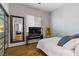 This bedroom features hardwood floors, a large decorative mirror, and a television on a stand at 1509 Winslow St, Las Vegas, NV 89117