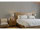 Bedroom features a wood-paneled accent wall and bedside table at 1509 Winslow St, Las Vegas, NV 89117