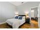 This bedroom features hardwood floors, a comfortable bed, and a nightstand at 1509 Winslow St, Las Vegas, NV 89117