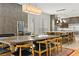 Open-concept dining area connects to the kitchen with a long table and stylish chairs at 1509 Winslow St, Las Vegas, NV 89117