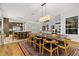 Dining area showcasing the modern design and open layout with view of the kitchen at 1509 Winslow St, Las Vegas, NV 89117