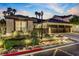 Well-manicured front yard with mature trees, exterior lighting, and a spacious driveway at 1509 Winslow St, Las Vegas, NV 89117