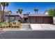 Beautiful exterior showcasing a three-car garage and desert landscaping at 1509 Winslow St, Las Vegas, NV 89117