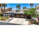 Charming single-story home with a three-car garage, desert landscaping, and mature palm trees at 1509 Winslow St, Las Vegas, NV 89117